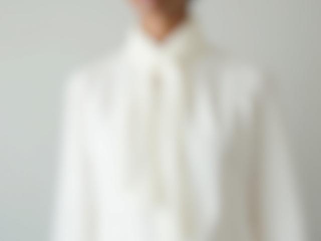 Aria White Silk Blouse, elegant and flowing, featuring subtle embroidered musical notes.